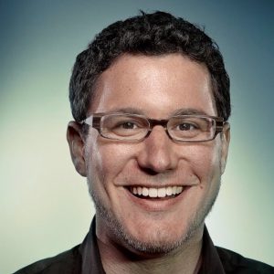 Eric Ries photo white man with black hair on a white and blue background